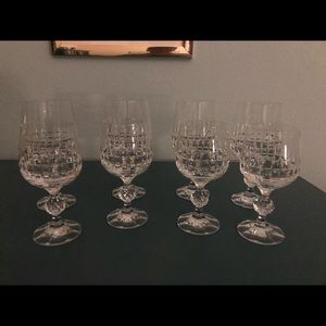 Eight crystal wine glasses.